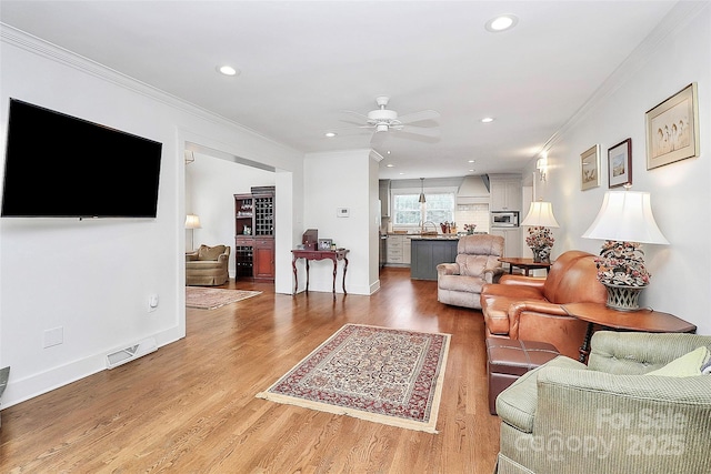 427 Lansdowne Rd, Charlotte, NC 28270 - living area featuring a ceiling fan, ornamental molding, recessed lighting, and light wood finished floors