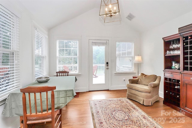 427 Lansdowne Rd, Charlotte, NC 28270 - sitting room with light wood-type flooring, vaulted ceiling, and a chandelier