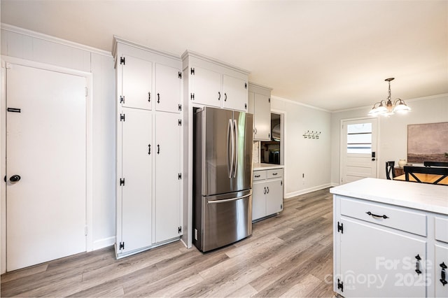 464 23rd Avenue Dr NE, Hickory, NC 28601 - kitchen with freestanding refrigerator, crown molding, light wood finished floors, light countertops, and a chandelier
