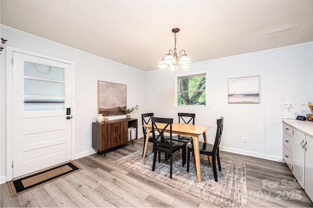 464 23rd Avenue Dr NE, Hickory, NC 28601 - dining space with ornamental molding, a chandelier, and wood finished floors