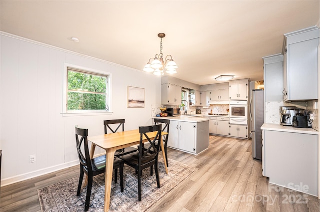464 23rd Avenue Dr NE, Hickory, NC 28601 - dining area with light wood finished floors and a chandelier