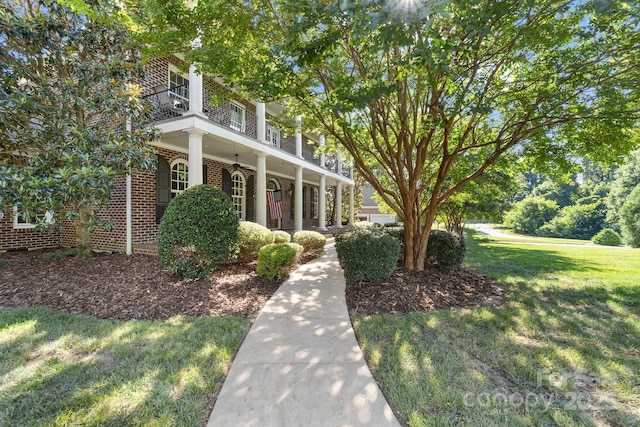 200 Galey Rdg, Cramerton, NC 28032 - view of front of property with a balcony, brick siding, a front lawn, ceiling fan, and covered porch