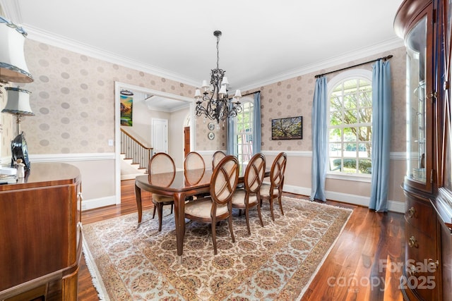 200 Galey Rdg, Cramerton, NC 28032 - dining space with a chandelier, a wainscoted wall, wood finished floors, wallpapered walls, and crown molding