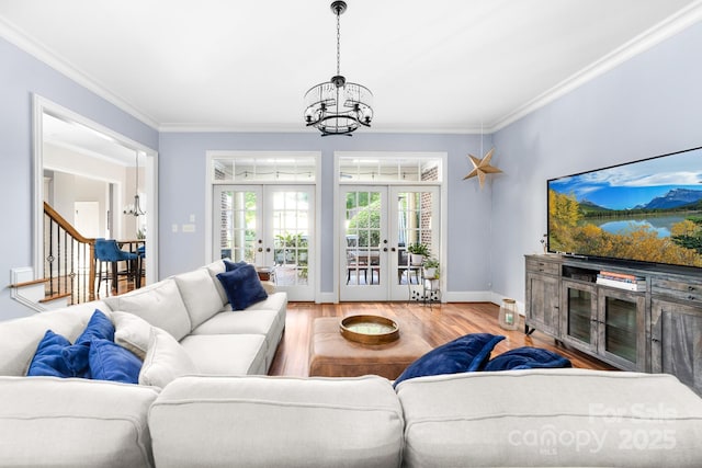 200 Galey Rdg, Cramerton, NC 28032 - living area featuring french doors, a chandelier, wood finished floors, crown molding, and stairs