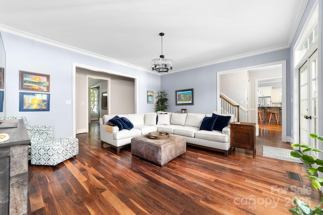 200 Galey Rdg, Cramerton, NC 28032 - living room with dark wood-style floors, stairs, crown molding, and a chandelier