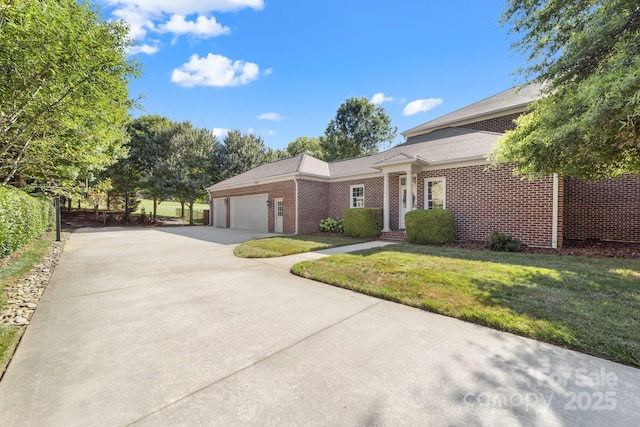 200 Galey Rdg, Cramerton, NC 28032 - ranch-style house with brick siding, concrete driveway, an attached garage, and a front yard