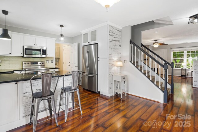 181 Farington Cir, Fletcher, NC 28732 - kitchen featuring stainless steel appliances, white cabinets, ceiling fan, and dark wood-style flooring