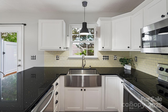 181 Farington Cir, Fletcher, NC 28732 - kitchen featuring appliances with stainless steel finishes, white cabinetry, and backsplash
