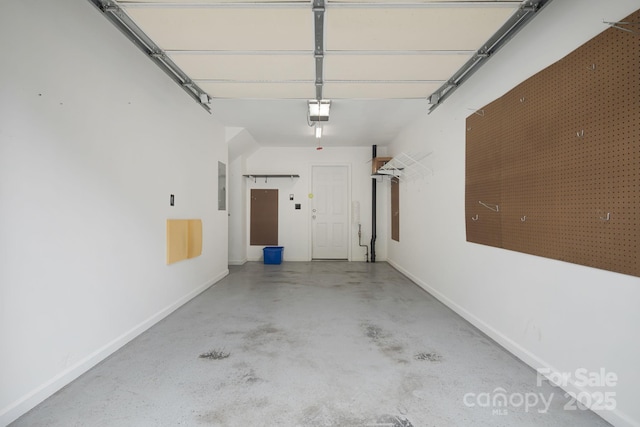 181 Farington Cir, Fletcher, NC 28732 - garage with baseboards and electric panel