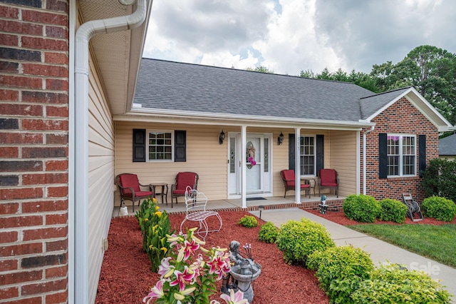 515 E Carpenter St, Maiden, NC 28650 - view of front of property featuring a porch, roof with shingles, and brick siding
