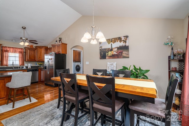 515 E Carpenter St, Maiden, NC 28650 - dining space with washer / dryer, wood finished floors, arched walkways, a chandelier, and ceiling fan
