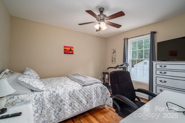 515 E Carpenter St, Maiden, NC 28650 - bedroom with wood finished floors, a desk, and a ceiling fan