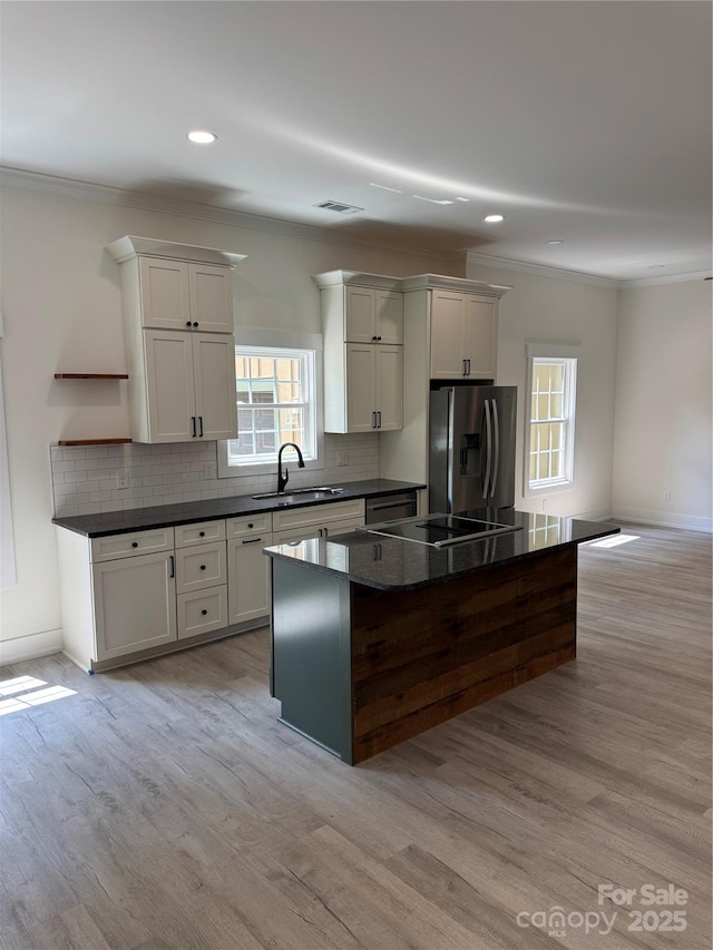 7187 Sherrills Ford Rd, Sherrills Ford, NC 28673 - kitchen with appliances with stainless steel finishes, ornamental molding, open shelves, plenty of natural light, and tasteful backsplash