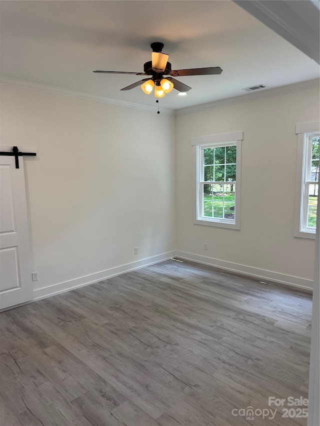 7187 Sherrills Ford Rd, Sherrills Ford, NC 28673 - unfurnished room with ornamental molding, plenty of natural light, wood finished floors, and a ceiling fan