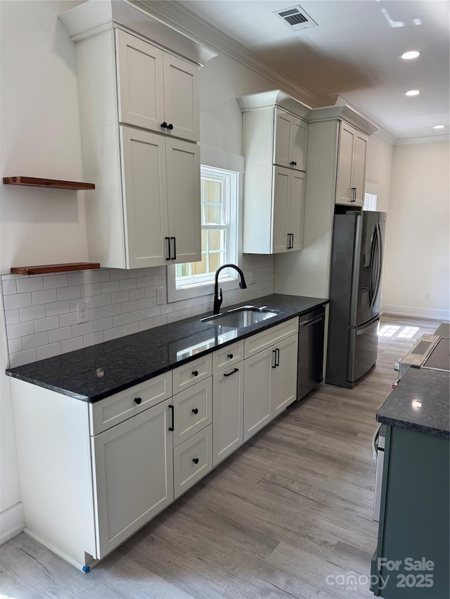7187 Sherrills Ford Rd, Sherrills Ford, NC 28673 - kitchen with appliances with stainless steel finishes, open shelves, light wood-style floors, crown molding, and backsplash