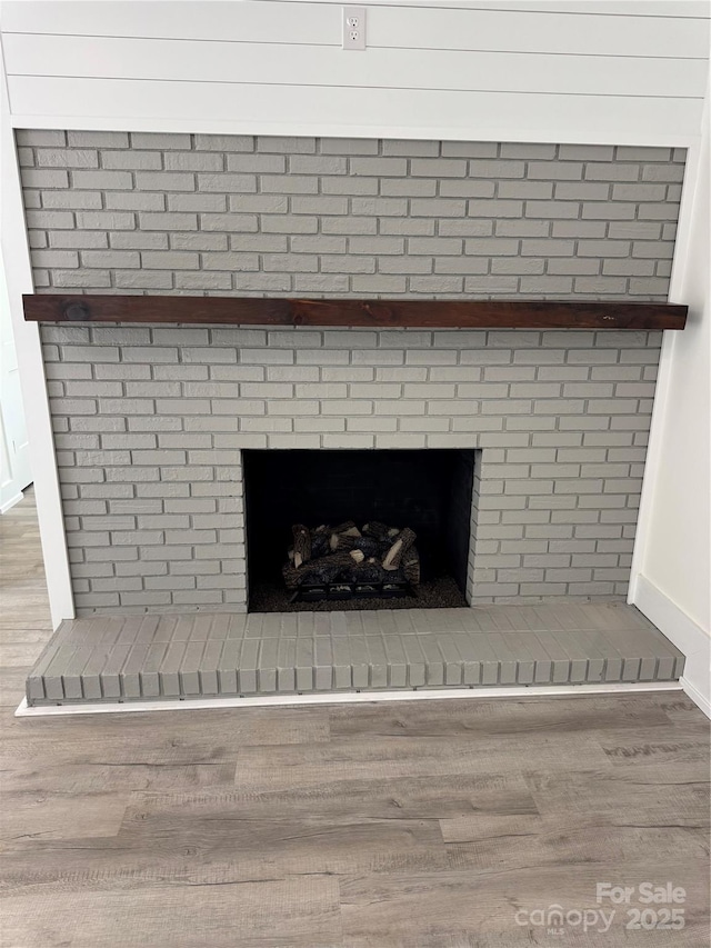 7187 Sherrills Ford Rd, Sherrills Ford, NC 28673 - detailed view of a brick fireplace and wood finished floors