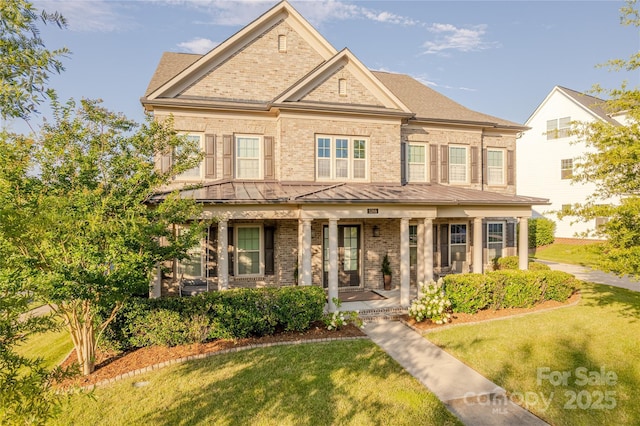 5266 Meadowcroft Way, Fort Mill, SC 29708 - view of front of property featuring a porch, brick siding, a standing seam roof, a front yard, and a metal roof