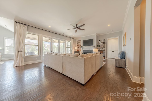 5266 Meadowcroft Way, Fort Mill, SC 29708 - living room featuring a ceiling fan, a fireplace, dark wood-type flooring, ornamental molding, and recessed lighting