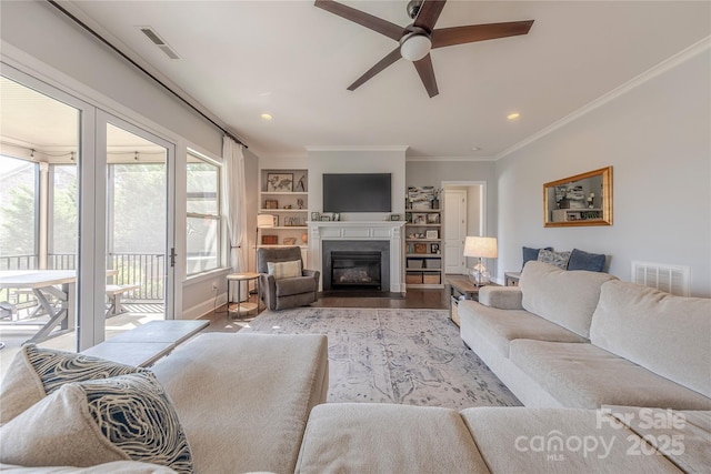 5266 Meadowcroft Way, Fort Mill, SC 29708 - living area featuring ceiling fan, wood finished floors, ornamental molding, a fireplace with flush hearth, and recessed lighting