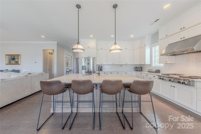 5266 Meadowcroft Way, Fort Mill, SC 29708 - kitchen with appliances with stainless steel finishes, white cabinetry, tasteful backsplash, crown molding, and recessed lighting