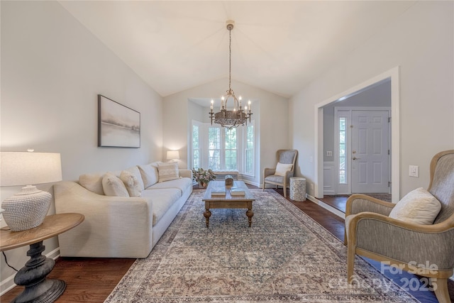2836 Providence Spring Ln, Charlotte, NC 28270 - living room featuring dark wood-style floors, a chandelier, and vaulted ceiling