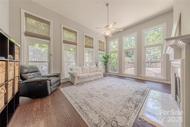 2836 Providence Spring Ln, Charlotte, NC 28270 - living room featuring plenty of natural light, wood finished floors, a ceiling fan, and a fireplace with flush hearth