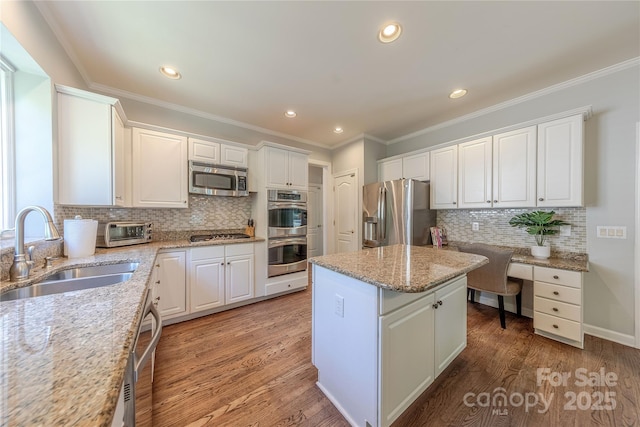 2836 Providence Spring Ln, Charlotte, NC 28270 - kitchen featuring stainless steel appliances, a center island, white cabinetry, tasteful backsplash, and recessed lighting