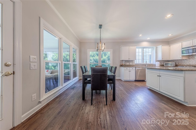2836 Providence Spring Ln, Charlotte, NC 28270 - dining room with ornamental molding, dark wood-style floors, a chandelier, and recessed lighting