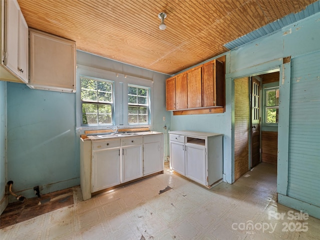 55 Shook St, Clyde, NC 28721 - kitchen with wooden ceiling, light countertops, and light flooring