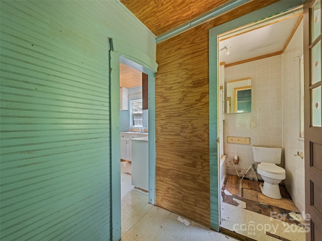 55 Shook St, Clyde, NC 28721 - corridor with light floors, wood walls, ornamental molding, and tile walls