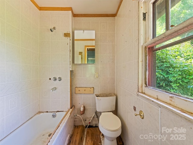 55 Shook St, Clyde, NC 28721 - full bath with healthy amount of natural light, tile walls, ornamental molding, wood finished floors, and shower / washtub combination