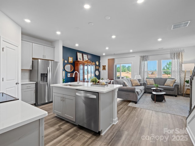 4170 County Down Ave, Kannapolis, NC 28081 - kitchen featuring appliances with stainless steel finishes, light countertops, light wood-style flooring, and recessed lighting