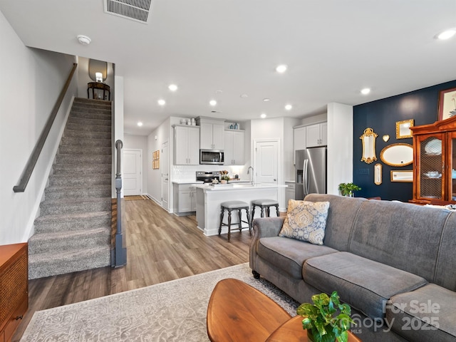 4170 County Down Ave, Kannapolis, NC 28081 - living area featuring stairs, light wood finished floors, and recessed lighting