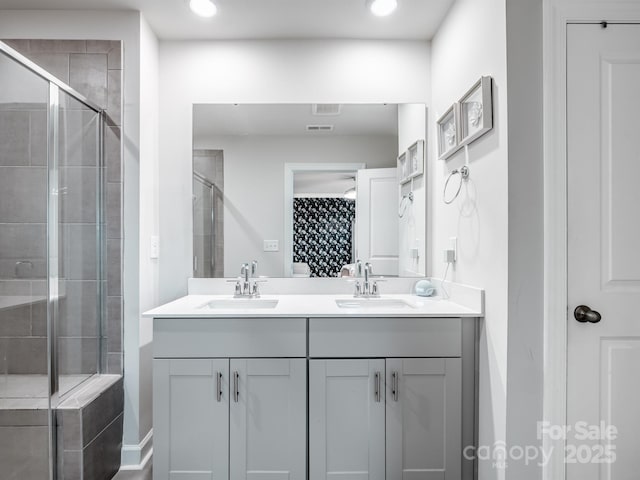 4170 County Down Ave, Kannapolis, NC 28081 - bathroom featuring double vanity, a shower stall, and recessed lighting