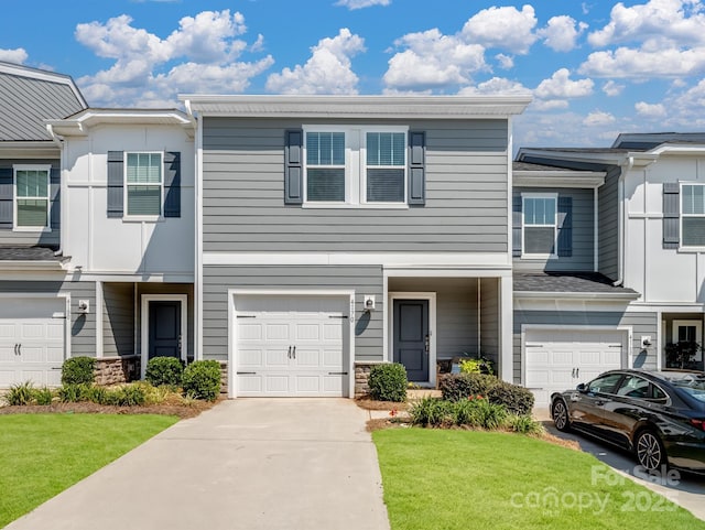4170 County Down Ave, Kannapolis, NC 28081 - view of property featuring a garage, a front yard, driveway, and stone siding