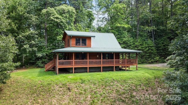 55 Kirkland Mountain Ln, Bryson City, NC 28713 - rear view of property with covered porch, a yard, a metal roof, and a forest view