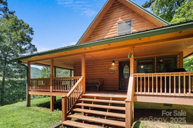 55 Kirkland Mountain Ln, Bryson City, NC 28713 - view of front of property featuring covered porch, faux log siding, and stairway