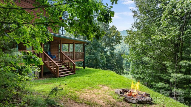55 Kirkland Mountain Ln, Bryson City, NC 28713 - view of grassy yard with a fire pit and stairs