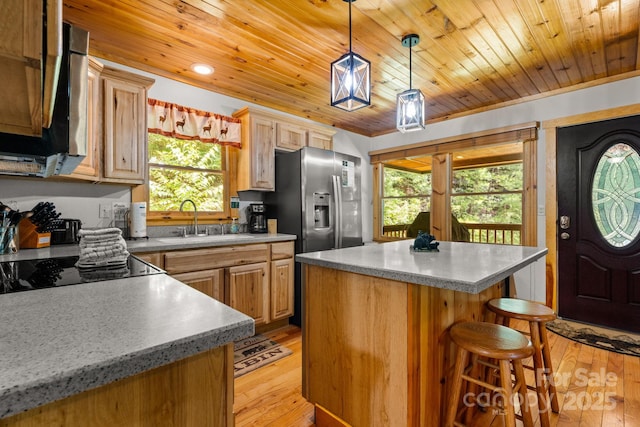 55 Kirkland Mountain Ln, Bryson City, NC 28713 - kitchen featuring stainless steel microwave, light wood-style floors, a center island, plenty of natural light, and wood ceiling