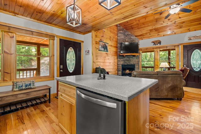 55 Kirkland Mountain Ln, Bryson City, NC 28713 - kitchen featuring stainless steel dishwasher, lofted ceiling, a stone fireplace, light wood-type flooring, and wooden ceiling