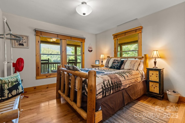 55 Kirkland Mountain Ln, Bryson City, NC 28713 - bedroom featuring hardwood / wood-style floors and access to outside
