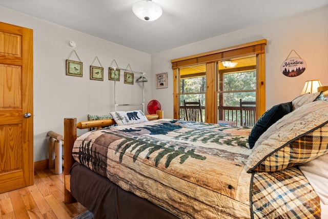 55 Kirkland Mountain Ln, Bryson City, NC 28713 - bedroom featuring hardwood / wood-style flooring and access to outside