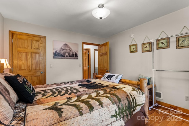 55 Kirkland Mountain Ln, Bryson City, NC 28713 - bedroom featuring wood finished floors and baseboards
