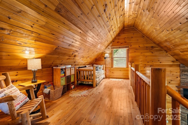 55 Kirkland Mountain Ln, Bryson City, NC 28713 - bedroom featuring wooden ceiling, wood walls, vaulted ceiling, light wood-style floors, and a sauna