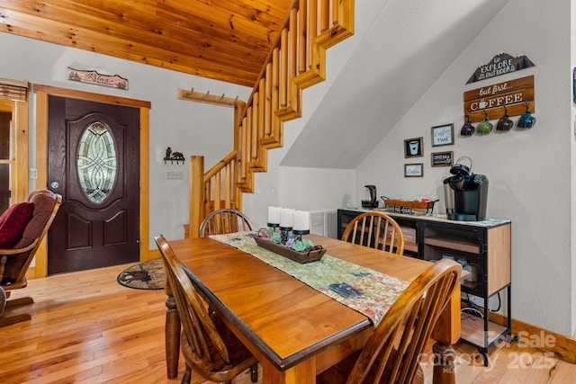 55 Kirkland Mountain Ln, Bryson City, NC 28713 - dining area featuring vaulted ceiling, light wood finished floors, and stairway
