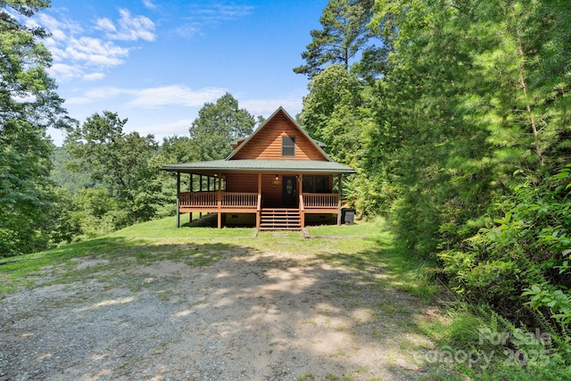 55 Kirkland Mountain Ln, Bryson City, NC 28713 - log home featuring a metal roof, a wooden deck, and a wooded view