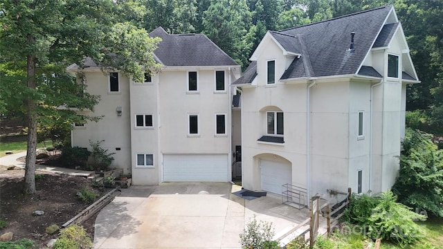 1802 Walden Pond Ln, Waxhaw, NC 28173 - view of front facade featuring stucco siding, roof with shingles, concrete driveway, and an attached garage