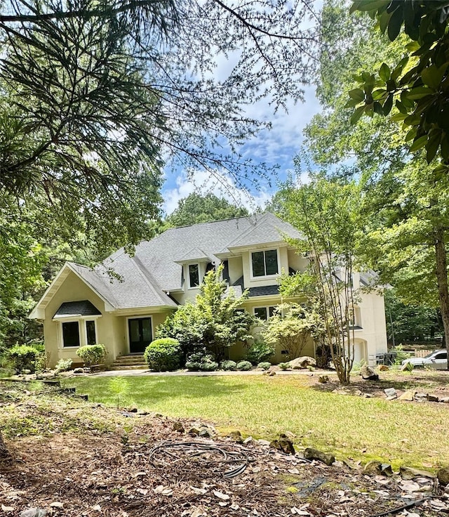 1802 Walden Pond Ln, Waxhaw, NC 28173 - view of front of home featuring a front yard, stucco siding, and roof with shingles