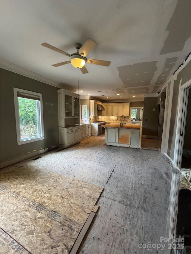 1802 Walden Pond Ln, Waxhaw, NC 28173 - unfurnished living room with healthy amount of natural light, a ceiling fan, crown molding, and recessed lighting