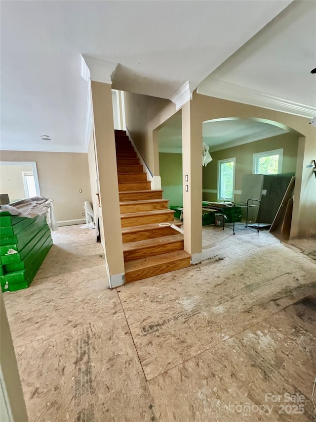 1802 Walden Pond Ln, Waxhaw, NC 28173 - staircase with crown molding, healthy amount of natural light, and arched walkways